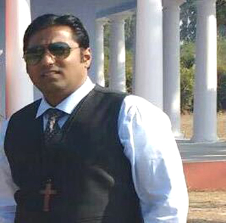 Rev. Arpan E. Jacob